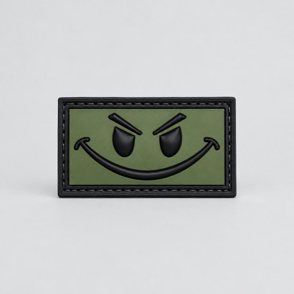 Patch OD Green and Black Smiley PVC with hook-and-loop backing, perfect for enhancing your gear.