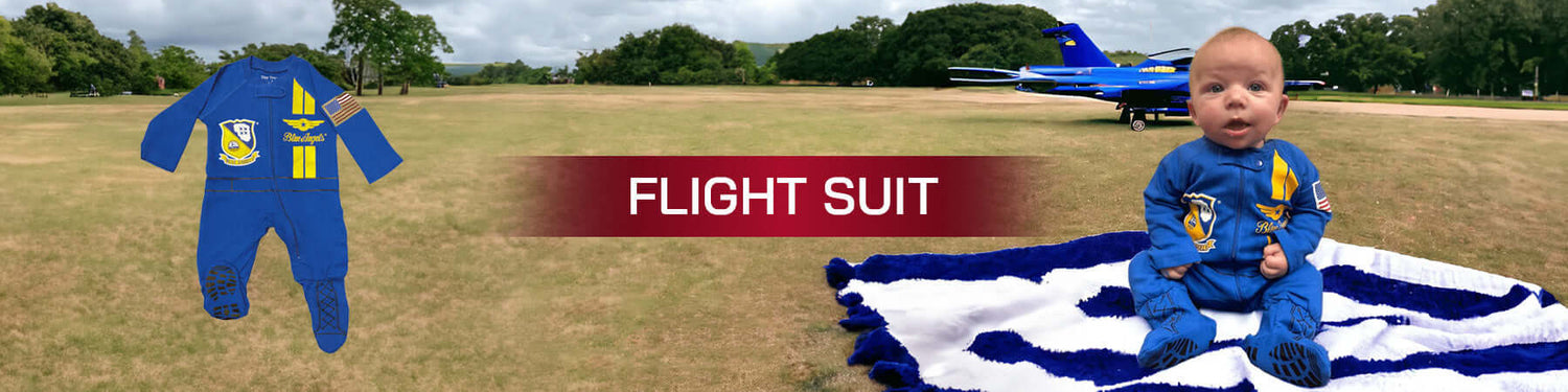 Infant Flight Suits OD collection featuring a baby in a flight suit, set outdoors with an airplane in the background.