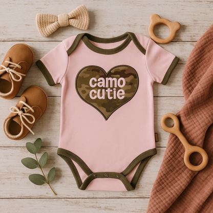 Baby Multicam Camo Cutie Bodysuit in camouflage print, adorable design for infant, green and brown tones.