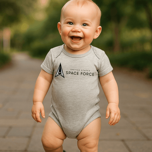 Baby wearing a gray Space Force Baby Bodysuit with a happy smile, perfect for little troopers.