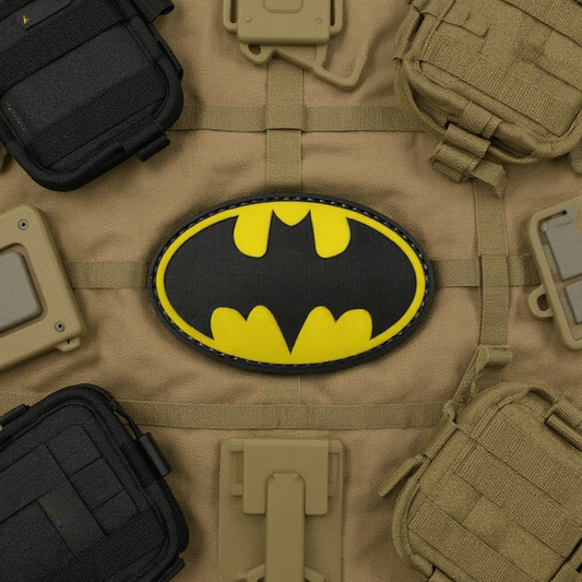 Batman yellow PVC patch on a solid background, featuring iconic superhero logo.