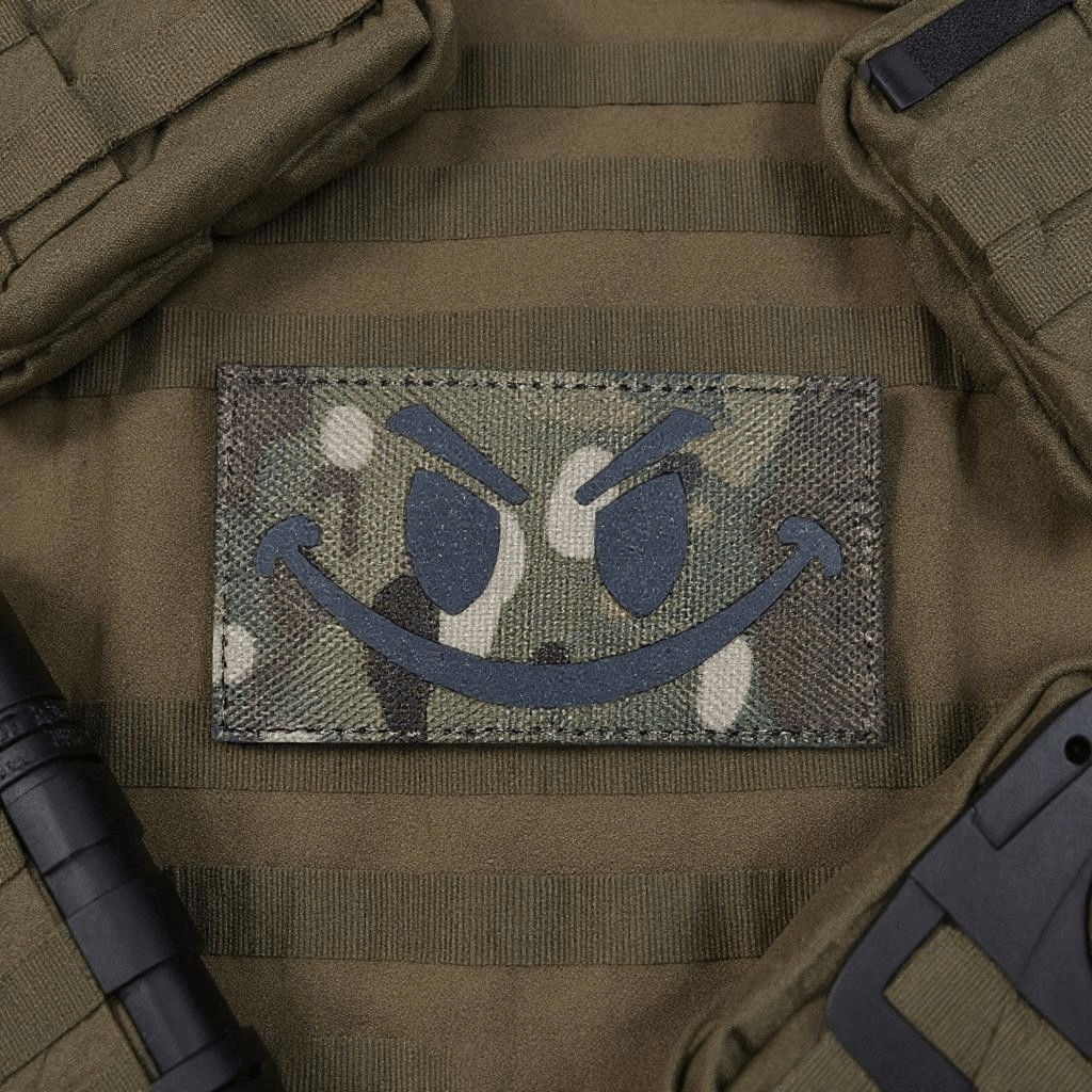 Patch Smiley Multicam Evil Laser Cut patch on tactical gear for added style and visibility.
