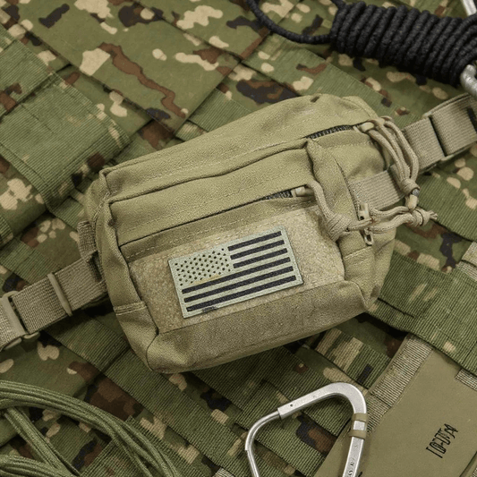 Tactical Fanny Pack Coyote on camouflage background with American flag patch.