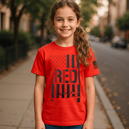 Trooper Clothing red youth t-shirt featuring a patriotic Remember Everyone Deployed graphic and American flag sleeve